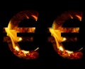 Euro money business symbol made from fire and burning wood on a black background, a double version of the alphabet for decorative Royalty Free Stock Photo