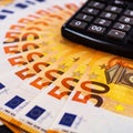 50 Euro Money. euro cash background. Lots of Euro money on the calculator. Banknotes background of Euros of Europe, EUR currency. Royalty Free Stock Photo