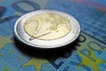 Euro money - 2 Euro coin on a banknote