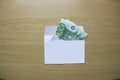 Euro money lie in an envelope on table in office Royalty Free Stock Photo