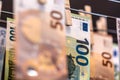 Euro notes on clothesline. Money laundering on clothesline. Money Laundering euro hung out to dry. Royalty Free Stock Photo