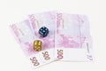Euro notes and dice