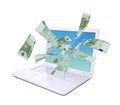 Euro notes flying around the laptop Royalty Free Stock Photo