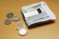 Euro Notes In Money Clip And Coins On Table Royalty Free Stock Photo