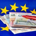 Euro notes and red pencil, EU flag Royalty Free Stock Photo