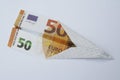 Euro paper bill. Paper aeroplane made of euro bill. Paper plane. Royalty Free Stock Photo