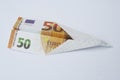 Euro paper bill. Paper aeroplane made of euro bill. Paper plane. Royalty Free Stock Photo