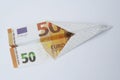 Euro paper bill. Paper aeroplane made of euro bill. Paper plane. Royalty Free Stock Photo