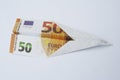 Euro paper bill. Paper aeroplane made of euro bill. Paper plane. Royalty Free Stock Photo