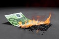 100 Euro bill is burning bright