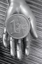 Euro silver coin of futuristic metallic hand