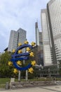 The Euro Skulptur sits in front of the skyscrapers making up the financial district of Frankfurt, Germany Royalty Free Stock Photo