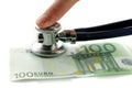 Euro with stethoscope and finger Royalty Free Stock Photo