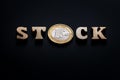 Euro STOCK. Word from wooden letters with a european coin on a black background. Selective focus. Copy space. Shallow depth of Royalty Free Stock Photo