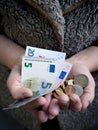 Euro trifle in the hands of a pensioner. Royalty Free Stock Photo