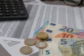 Euro and ÃÂµuro coins lying on the financial schedule