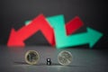 Euro versus dollar on black background. Red and green arrow intertwined showing indecision in the stock market Royalty Free Stock Photo