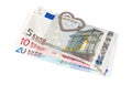 Eurobanknotes with a paper clip in the form of heart Royalty Free Stock Photo