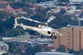 Eurocopter AS-350BA Helicopter conducting aerial filming with a nose mounted Cineflex camera over Melbourne Royalty Free Stock Photo