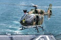 The Eurocopter EC 645 T2 helicopter of royal Thai navy land on the flight deck of HTMS. Bhumibol Adulyadej