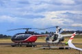 Eurocopter and Robinson helicopters at an airport Royalty Free Stock Photo