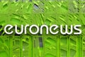 Euronews logo on a wall