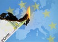 100 Euro banknote burns, with european map in background