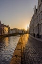 Belgium, Bruges, a bridge over a body of water with a city in the background Royalty Free Stock Photo