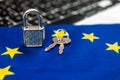 Europe cyber security concept. Padlock on computer keyboard and EU flag. Close-up view photo