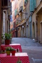 Europe Deserted Street with Out of Focus Tables in Foreground