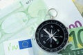 Europe economy direction, financial, investment or impact of brexit concept, compass put beside Europe map and Euro flag on Euro