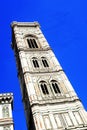 Europe, Italy, Florence, Giotto& x27;s Campanile. Tall clock tower next to the city dome with blue sky background