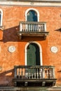 Italy, Venice, a bench in front of a brick building