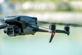 Europe, July 10, 2022: New drone DJI mavic 3 hovered in the air against the background of an industrial facility. Parts of a new