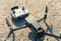 Europe, July 10, 2022: New drone DJI mavic 3 and remote control are standing on a concrete surface. Parts of a new modern