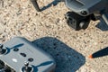 Europe, July 10, 2022: New drone DJI mavic 3 and remote control are standing on a concrete surface. Parts of a new modern