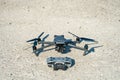 Europe, July 10, 2022: New drone DJI mavic 3 and remote control are standing on a concrete surface. Parts of a new modern