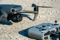 Europe, July 10, 2022: New drone DJI mavic 3 and remote control are standing on a concrete surface. Parts of a new modern