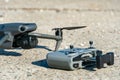 Europe, July 10, 2022: New drone DJI mavic 3 and remote control are standing on a concrete surface. Parts of a new modern