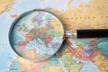 Bangkok, Thailand - August 01, 2020 Europe, Magnifying glass close up with colorful world map Royalty Free Stock Photo