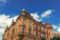 Europe medieval stone building exterior facade architecture object foreshortening from below on vivid blue sky background space in