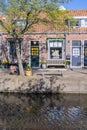 Small brick buildings along a canal