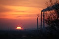 Europe. Poland. Ecology. Smoky chimneys of the factory in the sunset. Autumn 2017