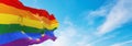 Europe rainbow gay pride flag waving in the wind at cloudy sky. Freedom and love concept. Pride month. activism, community and