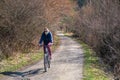 EUROPE - Slovakia, 25. May 2020: Young Woman Cycling with Mask on her Face