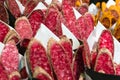 Europe, Spain, Barcelona. Pieces of sliced and pre-packaged salami in the market