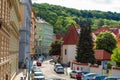 Europe street, buildings with red tiles and green trees