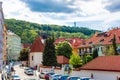 Europe street, buildings with red tiles and green trees