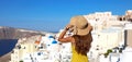 Europe tourist travel woman panorama banner from Oia, Santorini, Greece. Fashion young woman looking at famous blue dome church Royalty Free Stock Photo