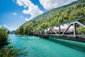 Europe train in Interlaken town over Thunersee river Royalty Free Stock Photo